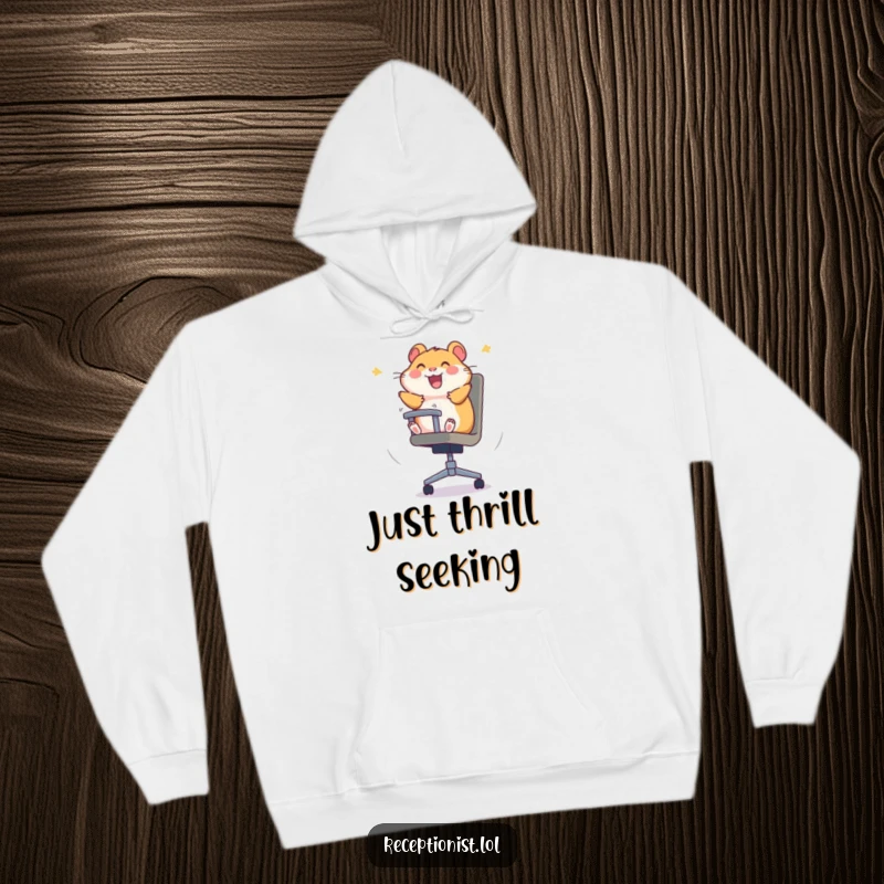 A soft, funny hamster hoodie depicting a hamster's joyful abandon spinning in an office chair, perfect for comfy fun.