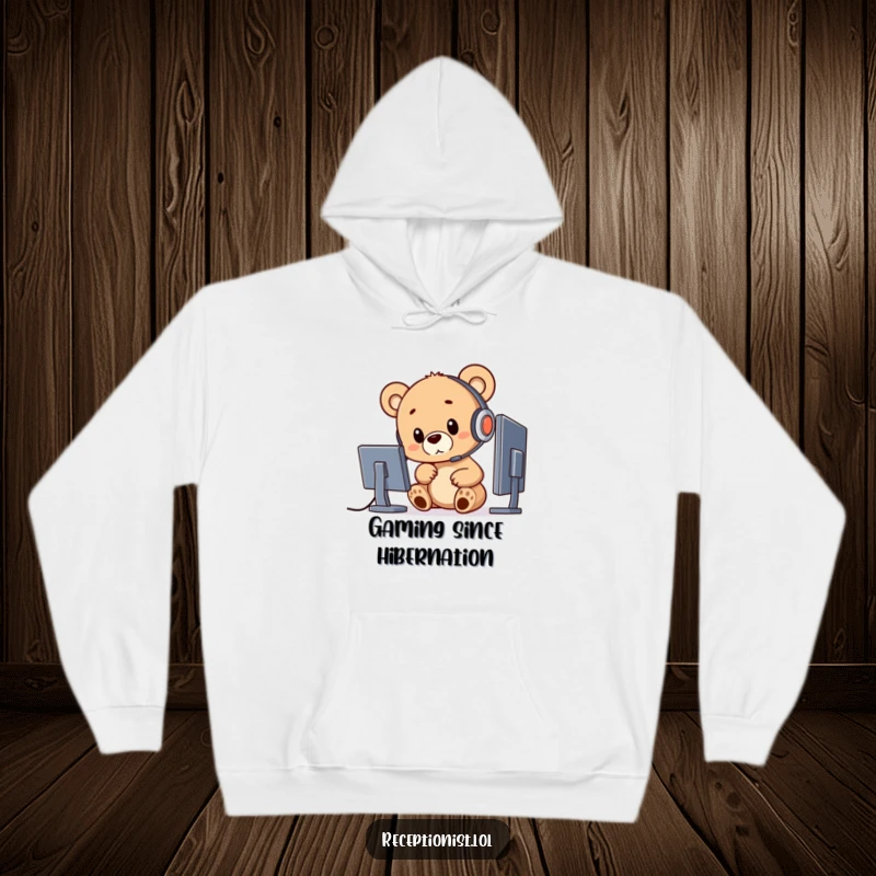 Funny bear cub in a headset pointing at a computer, making this a cozy and humorous hoodie.