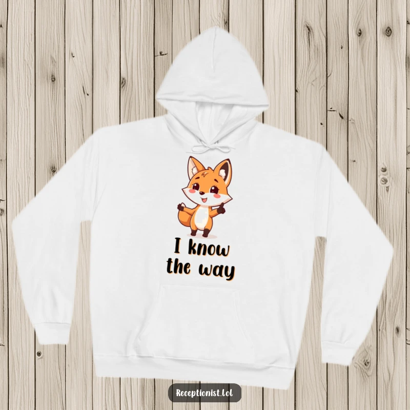 Funny fox directing hoodie, pointing with a smile, showing a playful and helpful gesture, great for staying warm.