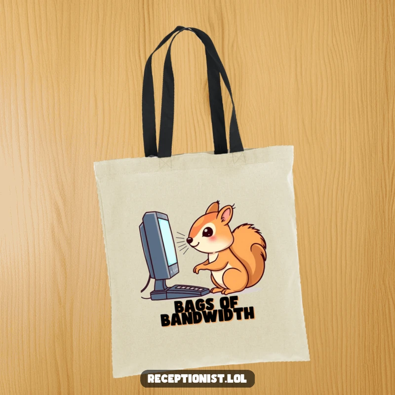 Funny tote bag displaying a focused squirrel working on a computer, designed for carrying tech gear with a humorous touch.